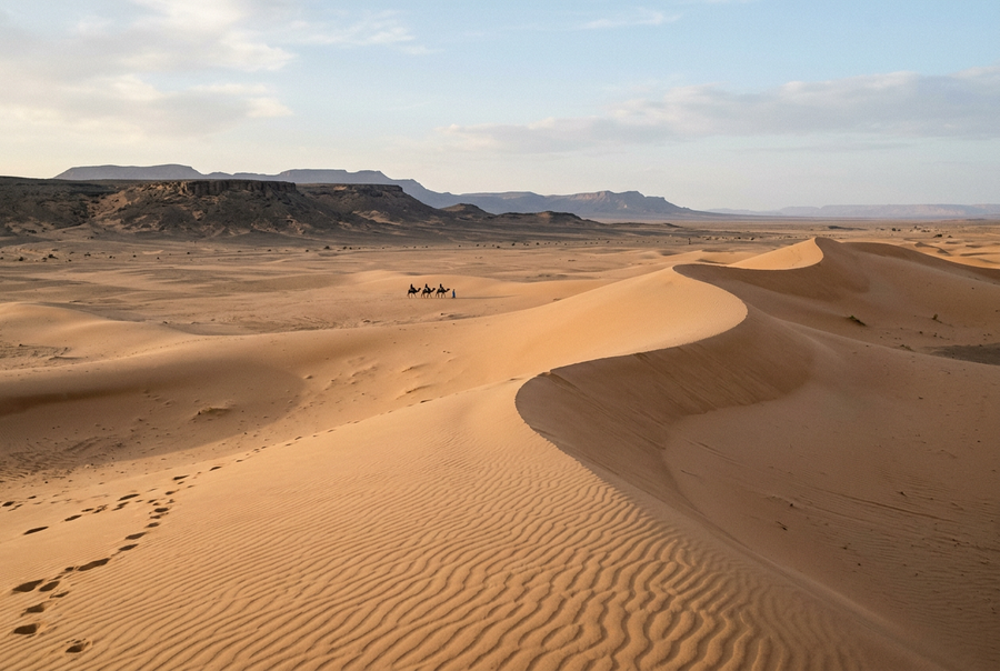 Dunes et caravane au Sahara, image de synthèse d’inspiration